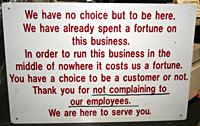 Don't complain sign at gas station in Mojave Desert